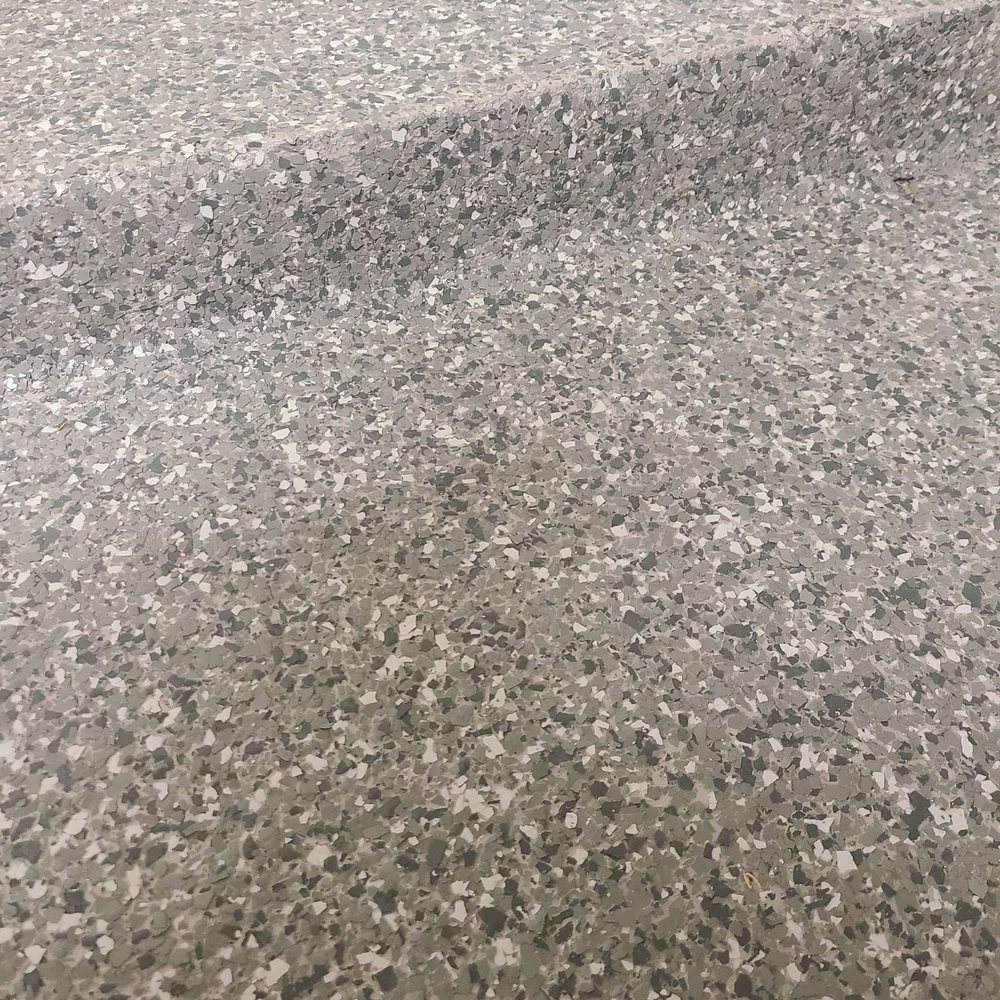 Garage Monkeyz - a closeup of a garage floor - Flooring Near Me - Austin, Texas
