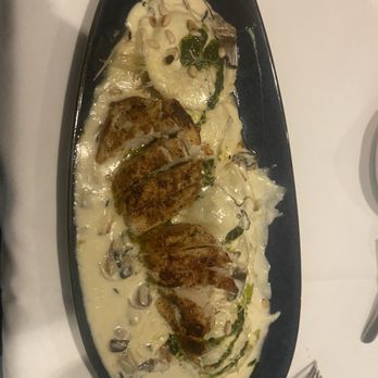 Larkin's - Wild Mushroom Ravioli with blackened chicken - Steakhouses Near Me - Greenville, South Carolina Larkin's - Wild Mushroom Ravioli with blackened chicken - Steakhouses Near Me - Greenville, South Carolina