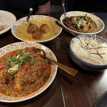 Baazi - Left to right: Chicken Sirka Pyaz, Butternut Squash Kofta, Bharwan Baingan, Basmati Rice - Indian Near Me - New York, New York Baazi - Left to right: Chicken Sirka Pyaz, Butternut Squash Kofta, Bharwan Baingan, Basmati Rice - Indian Near Me - New York, New York