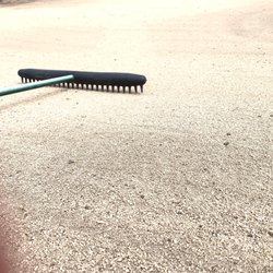 West Loch Golf Course - A rake in the bunker to understand there is no sand at all in the bunkers
