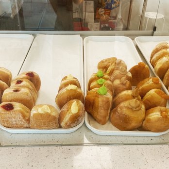 Starbread Bakery - Various flavors of malasada: ube, plain, guava, custard, coconut, pandan, caramel, nutella. - Bakeries Near Me - Las Vegas, Nevada