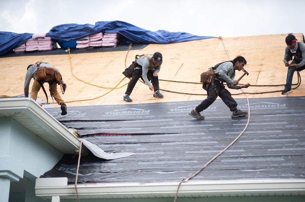 Slide of J Adams Roofing