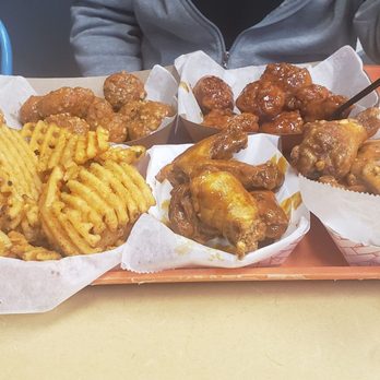 Crazy Mike's Wings - Top left to right boneless spicy parmesean and Korean sweet chili bottom waffle fries honey mustard and spicy garlic parmesean - Chicken Wings Near Me - Glendale, Arizona Crazy Mike's Wings - Top left to right boneless spicy parmesean and Korean sweet chili bottom waffle fries honey mustard and spicy garlic parmesean - Chicken Wings Near Me - Glendale, Arizona