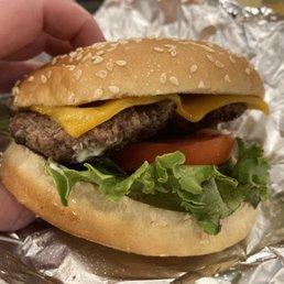 Single burger with toppings and cheese