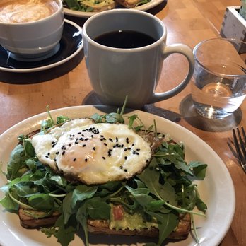 Commonwealth Cafe - Multigrain toast with guacamole, sesame seeds, arugula, and a fried egg instead of hard boiled. Delicious and surprisingly filling - Coffee & Tea Near Me - Birmingham, Michigan Commonwealth Cafe - Multigrain toast with guacamole, sesame seeds, arugula, and a fried egg instead of hard boiled. Delicious and surprisingly filling - Coffee & Tea Near Me - Birmingham, Michigan
