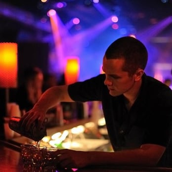 Pravda Nightclub - a bartender pouring a drink - Dance Clubs Near Me - Wilmington, North Carolina Pravda Nightclub - a bartender pouring a drink - Dance Clubs Near Me - Wilmington, North Carolina