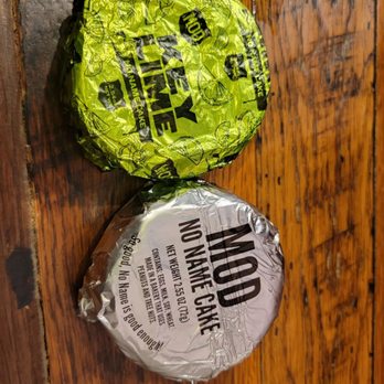MOD Pizza - two wrapped pizzas on a wooden table - Pizza Near Me - Kildeer, Illinois