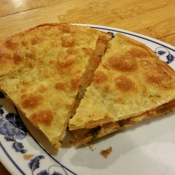 Taiwan Noodle - Scallion Pancakes (with two pieces already consumed) - Taiwanese Near Me - Albany, New York Taiwan Noodle - Scallion Pancakes (with two pieces already consumed) - Taiwanese Near Me - Albany, New York