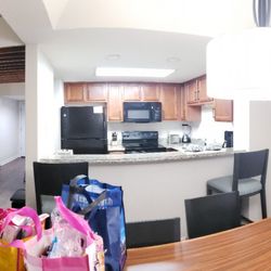 Club Wyndham Ocean Ridge - Living room on the left, dining on the right, small kitchen l, hallway to front door. Double doors is pantry and washer/dryer.