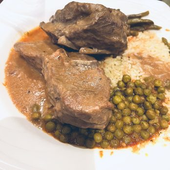 Uptown Parthenon - a plate of food on a table - Greek Near Me - West Bloomfield, Michigan