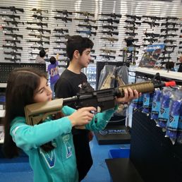 Then her trying her aim on an AR. Then her trying her aim on an AR.