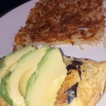 Eggsquisite Cafe - Allen - Bacado Omelet (spinach, bacon, tomatoes, swiss cheese topped with avocado) with hash browns for $10.00. - Breakfast & Brunch Near Me - Allen, Texas