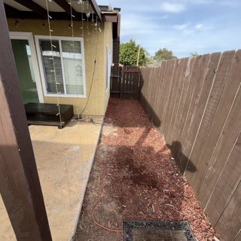 System Pavers - Before - Red wood chips in back yard on left side of house - Masonry/Concrete Near Me - San Marcos, California System Pavers - Before - Red wood chips in back yard on left side of house - Masonry/Concrete Near Me - San Marcos, California