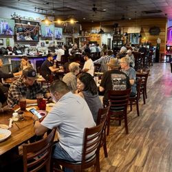 Bootleggers Pizza Parlor - Dining room - more tables and booths to the left out of the picture. Also outdoor seating and a children's playground out back.