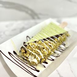 The Paleta Bar - Shanghai Plaza - Pistachio - half dipped in dark chocolate, pistachios, & drizzled white chocolate. :P