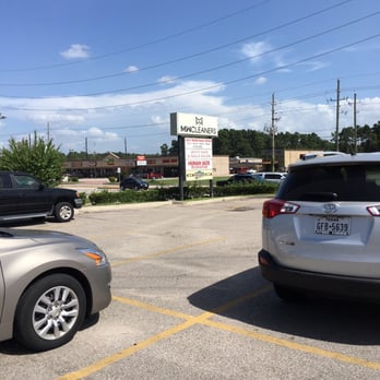 Hunan Jade - two cars parked in a parking lot - Chinese Near Me - Spring, Texas