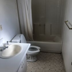 All Seasons Campground - Bathroom with a great hot shower and plenty of room for getting ready. Even space for luggage in open area under the counter (not visible.)