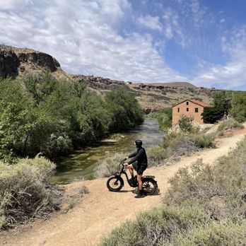 Better on E-Bikes - E-bike riding behind our storefront in Confluence Park La Verkin. - Bike Rentals Near Me - St George, Utah Better on E-Bikes - E-bike riding behind our storefront in Confluence Park La Verkin. - Bike Rentals Near Me - St George, Utah