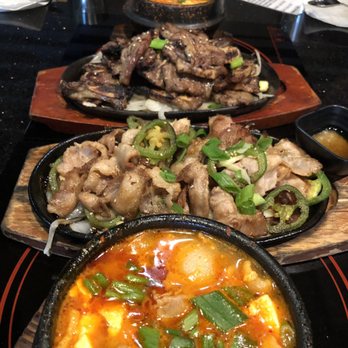 Hancook - From front to back: Soft Tofu Soup, Pork Belly, BBQ Short Rib, Kimchi Stew - Korean Near Me - Oakland, California Hancook - From front to back: Soft Tofu Soup, Pork Belly, BBQ Short Rib, Kimchi Stew - Korean Near Me - Oakland, California