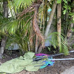 Anna Maria Vacations - 2 broken outdoor umbrellas left on the side of the lanai