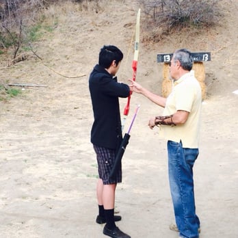 Pasadena Roving Archers - Robert was a really detailed instructor. Here he is showing my boyfriend how to grip the now properly. - Archery Near Me - Pasadena, California Pasadena Roving Archers - Robert was a really detailed instructor. Here he is showing my boyfriend how to grip the now properly. - Archery Near Me - Pasadena, California