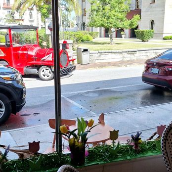 Claude's Chocolate - From the front windows, you can see the Alcazar at the right, the landscaped square, and this kitsch tourist train circulating in the center - Chocolatiers & Shops Near Me - St. Augustine, Florida