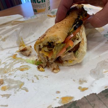 Subway - a person taking a bite out of a sandwich - Sandwiches Near Me - Indianapolis, Indiana