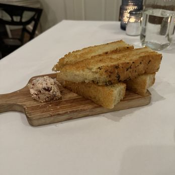 Table Twenty Five - House-made focaccia with cranberry butter. Amazing & delicious! - New American Near Me - Ogden, Utah