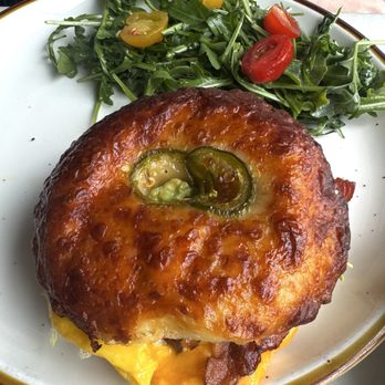 La Cigogne - Grizzly Bagel Sandwich- scrambled eggs, avocado, bacon, mixed greens, jalapeno cheddar bagel - French Near Me - Narrowsburg, New York