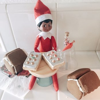 Sirens Sweets - a elf with a tray of cookies - Desserts Near Me