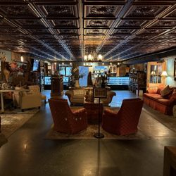 Epicure and Jack's Tavern - Head on view of the central lobby. Hostess stand is to the right- check out the wine selection in the back left.