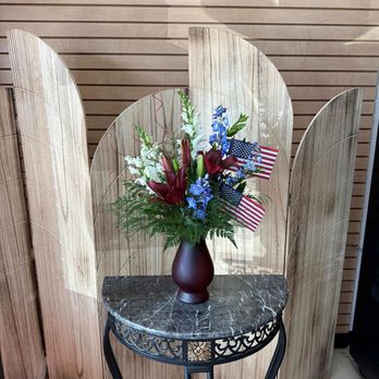 Dafferdil Floral Creations - High style patriotic arrangement including American Flags. - Florists Near Me - Meridian, Idaho Dafferdil Floral Creations - High style patriotic arrangement including American Flags. - Florists Near Me - Meridian, Idaho
