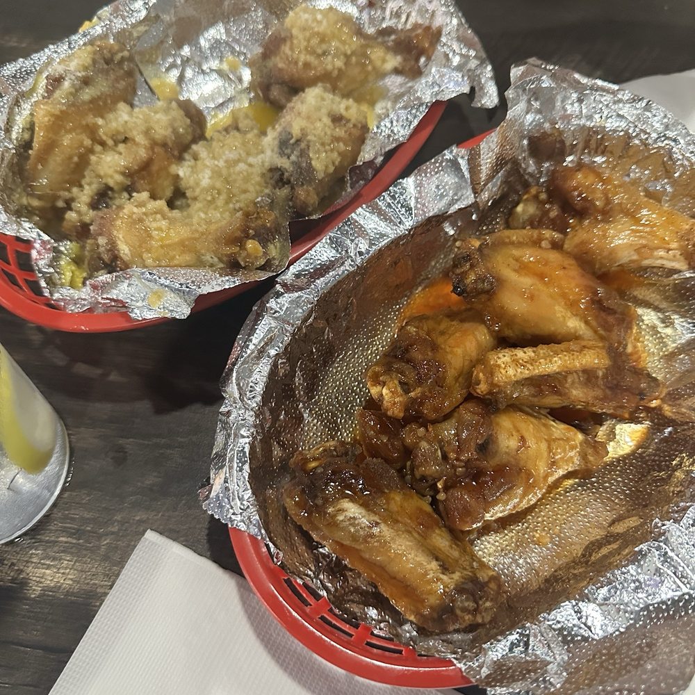 Tavern 26 - My hubby's wings!! Garlic Parmesan and Sweet Hot Honey (I think that's what they were called) lol! - Sports Bars Near Me - Campbell, Ohio