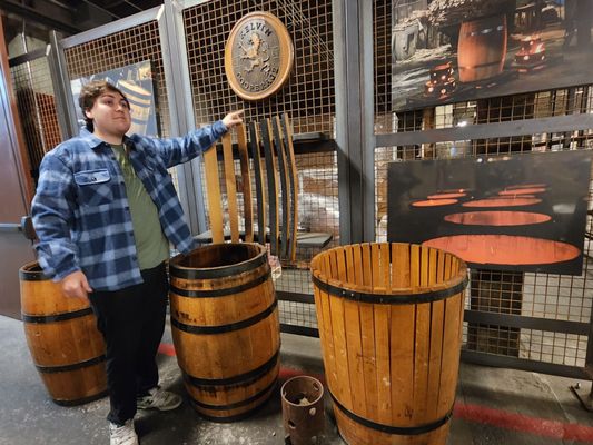 Photo of Kentucky Peerless Distilling - Louisville, KY, US. Chase, our tour guide, talking about the cooper and barrel chars