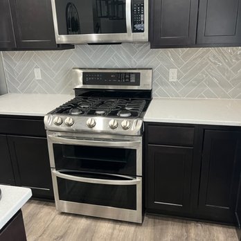 K5 Hard Surfaces - a kitchen with stainless steel appliances - Flooring Near Me - Cedar Lake, Indiana