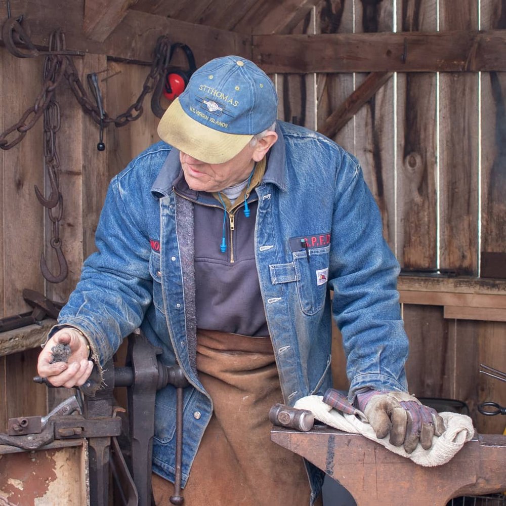 Merrifield Farm - Blacksmith showing children some coal. - Specialty Food Near Me - Gorham, Maine