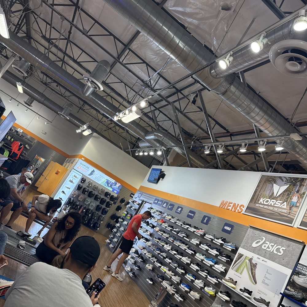 People waiting, waiting, waiting. They have a wonderful selection of all sorts of sports shoes. People waiting, waiting, waiting. They have a wonderful selection of all sorts of sports shoes.