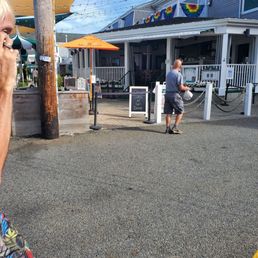 a man walking down the street talking on a cell phone a man walking down the street talking on a cell phone