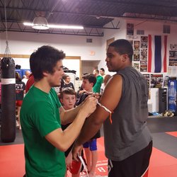 Impact Martial Arts and Conditioning - Rashon getting is orange arm