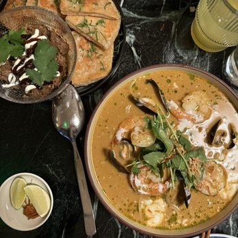 Siti - Roti Canai with Lamb (top left) and Laksa (bottom right) - Asian Fusion Near Me - Austin, Texas Siti - Roti Canai with Lamb (top left) and Laksa (bottom right) - Asian Fusion Near Me - Austin, Texas