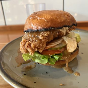 Abang Yoli - Chicken sandwich ($13) with fried chicken breast and sesame ginger garlic sauce. - Chicken Shop Near Me - Minneapolis, Minnesota Abang Yoli - Chicken sandwich ($13) with fried chicken breast and sesame ginger garlic sauce. - Chicken Shop Near Me - Minneapolis, Minnesota