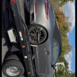 Advantage Wrecker and Roadside Assistance - Car on tow truck