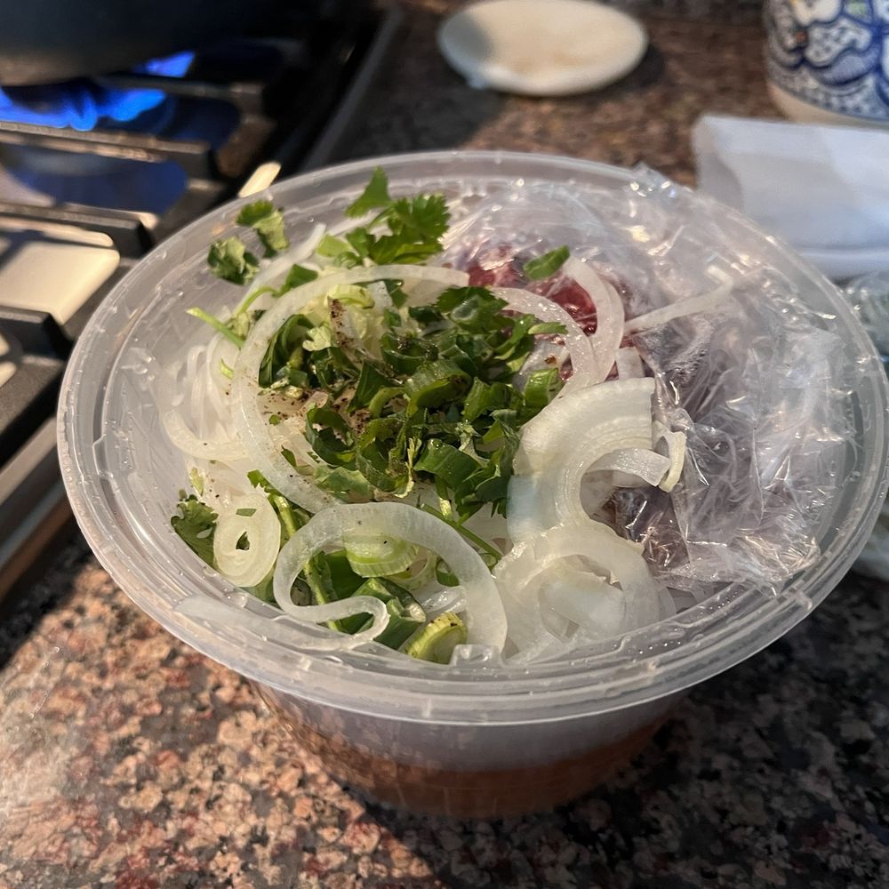 Lantern Vietnamese Kitchen - Pho broth on the bottom with vegetables and meat neatly separated at the top of container. - Breakfast & Brunch Near Me - Rancho Cucamonga, California Lantern Vietnamese Kitchen - Pho broth on the bottom with vegetables and meat neatly separated at the top of container. - Breakfast & Brunch Near Me - Rancho Cucamonga, California