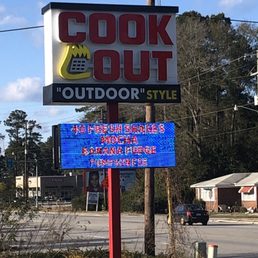 a sign in front of a restaurant a sign in front of a restaurant