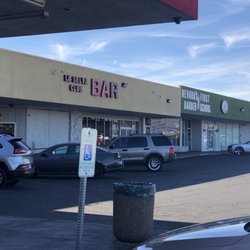 Beauty Supply Warehouse - Crummy businesses next door too cheap to even fix their own signs.