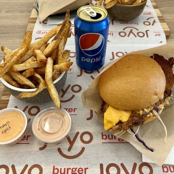 Joyo Burger - burger and fries on a table - Burgers Near Me - Montreal, Quebec Joyo Burger - burger and fries on a table - Burgers Near Me - Montreal, Quebec