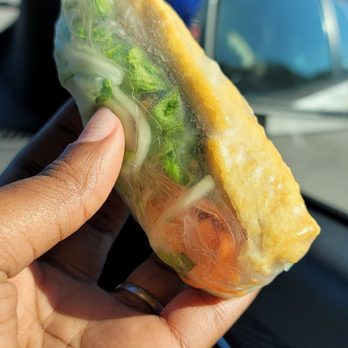 Pho Vietnam - a person holding a sandwich in their hand - Vietnamese Near Me - Raleigh, North Carolina