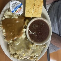 Chicken and dressing mashed potatoes, field peas, cornbread