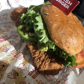 Smashburger - Spicy jalapeño Baja with crispy chicken(and oil spillage from the smashtots) - Burgers Near Me - Hicksville, New York Smashburger - Spicy jalapeño Baja with crispy chicken(and oil spillage from the smashtots) - Burgers Near Me - Hicksville, New York