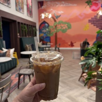 Cafe Unido - ORANGE RASPADURA LATTE Syrup made with melted panela and orange peel, topped with cinnamon and orange - Cafes Near Me - Washington, DC, District of Columbia